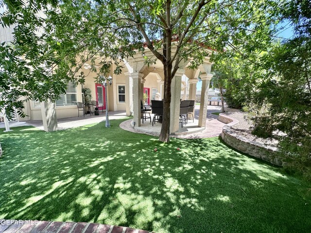 1363 Golden Trail Ln, El Paso, TX 79936 - view of grassy yard with a patio