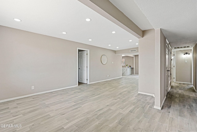 7113 Pear Tree Ln, El Paso, TX 79915 - unfurnished living room with light wood-style floors, recessed lighting, and baseboards