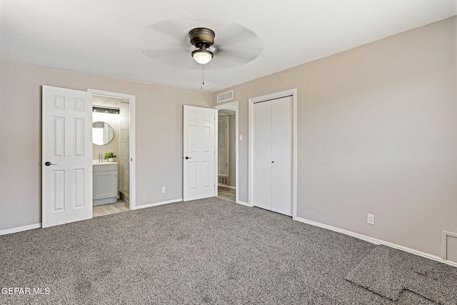 7113 Pear Tree Ln, El Paso, TX 79915 - unfurnished bedroom featuring carpet flooring, baseboards, a sink, and ensuite bathroom
