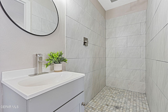 7113 Pear Tree Ln, El Paso, TX 79915 - bathroom with vanity and a tile shower