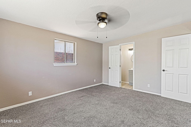 7113 Pear Tree Ln, El Paso, TX 79915 - unfurnished bedroom featuring carpet floors, baseboards, connected bathroom, and a ceiling fan