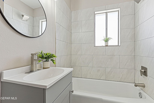 7113 Pear Tree Ln, El Paso, TX 79915 - full bathroom with vanity, shower / bathtub combination, and a textured wall