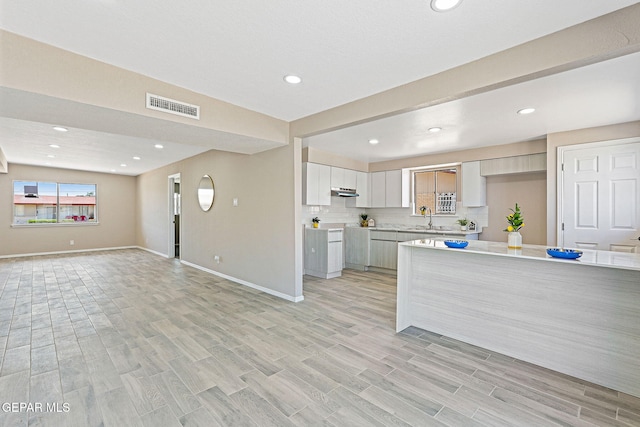 7113 Pear Tree Ln, El Paso, TX 79915 - kitchen with a sink, open floor plan, light countertops, baseboards, and recessed lighting