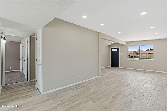 7113 Pear Tree Ln, El Paso, TX 79915 - unfurnished living room featuring light wood-style floors, baseboards, and recessed lighting