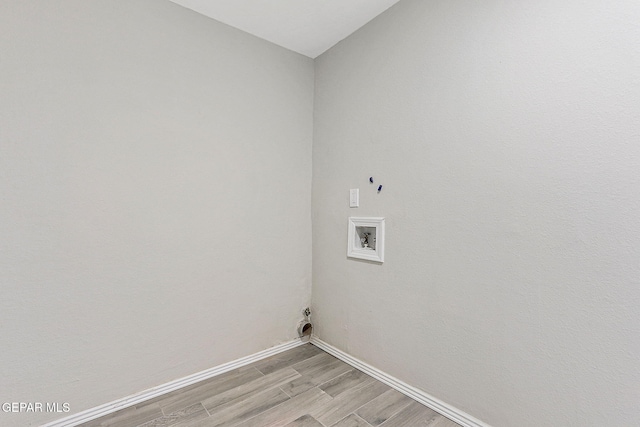 7113 Pear Tree Ln, El Paso, TX 79915 - washroom with light wood-style floors, washer hookup, and baseboards