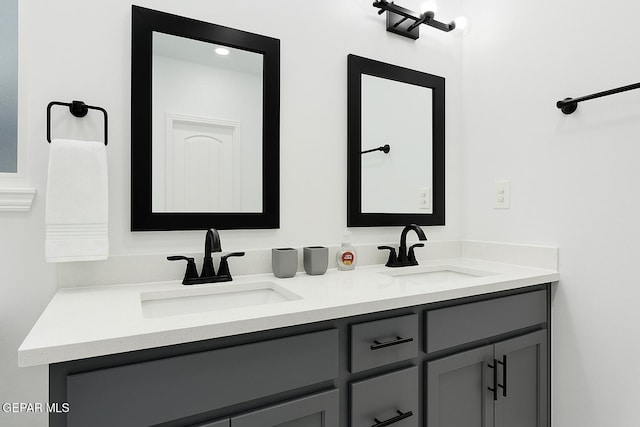 bathroom featuring double vanity and a sink