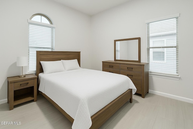 bedroom featuring baseboards
