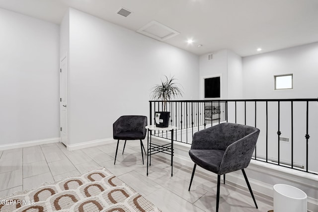 sitting room with recessed lighting, baseboards, visible vents, and attic access