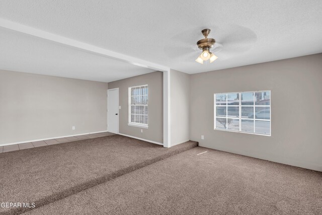10601 Teresa Pl, El Paso, TX 79924 - carpeted empty room with ceiling fan, plenty of natural light, and a textured ceiling