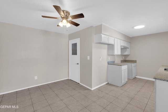 10601 Teresa Pl, El Paso, TX 79924 - kitchen featuring a ceiling fan, white cabinetry, light stone countertops, and baseboards