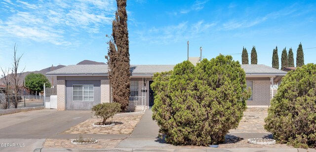 10601 Teresa Pl, El Paso, TX 79924 - view of property hidden behind natural elements featuring brick siding