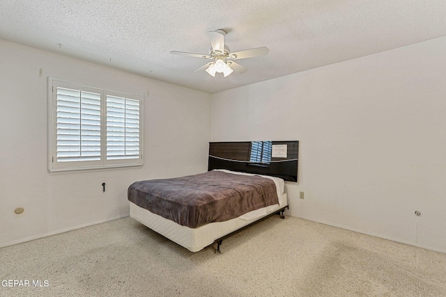 4800 N Stanton St Unit 87, El Paso, TX 79902 - bedroom featuring carpet flooring, a textured ceiling, baseboards, and a ceiling fan