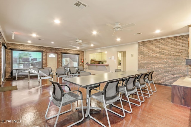 4800 N Stanton St Unit 87, El Paso, TX 79902 - dining area featuring visible vents, recessed lighting, ceiling fan, brick wall, and light wood-style floors