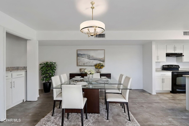 dining room with visible vents
