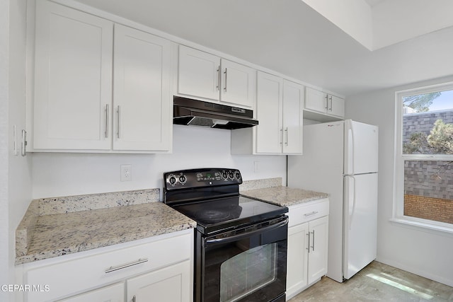kitchen with light stone countertops, black range with electric stovetop, white cabinets, freestanding refrigerator, and under cabinet range hood