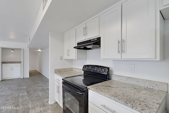 kitchen featuring light stone counters, under cabinet range hood, black electric range oven, and white cabinetry