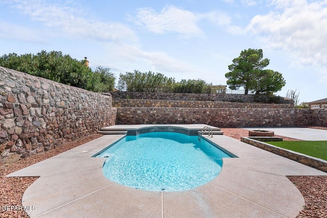 view of swimming pool featuring a fenced in pool, fence, and a patio