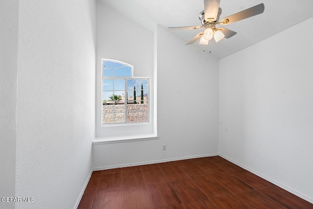 unfurnished room with vaulted ceiling, baseboards, a ceiling fan, and wood finished floors