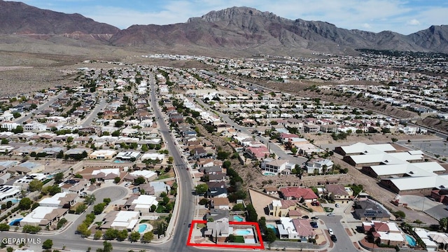 drone / aerial view with a residential view and a mountain view