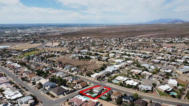 drone / aerial view featuring a residential view and a mountain view