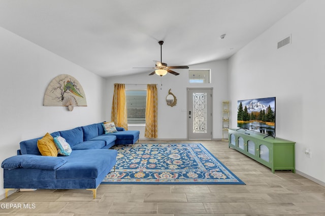 living room with a ceiling fan, visible vents, vaulted ceiling, wood finished floors, and baseboards