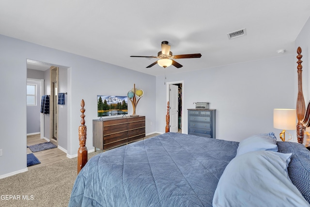 bedroom featuring baseboards, ceiling fan, carpet flooring, and visible vents
