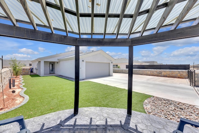 view of patio / terrace with concrete driveway and fence private yard