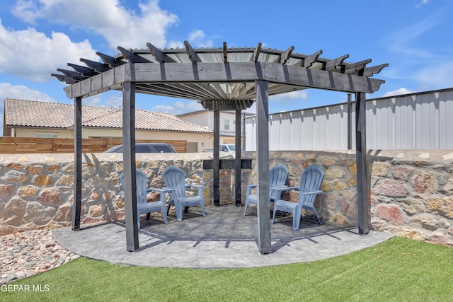 view of patio / terrace featuring a pergola and fence
