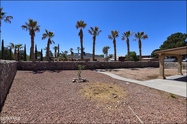 view of yard featuring a patio and fence
