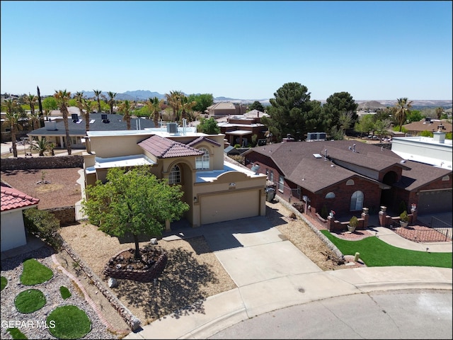 bird's eye view featuring a mountain view and a residential view