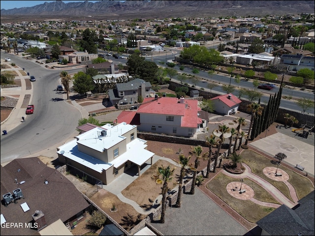 birds eye view of property with a mountain view and a residential view