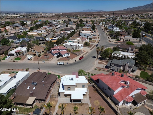 drone / aerial view featuring a mountain view and a residential view