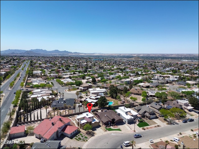 drone / aerial view featuring a residential view and a mountain view