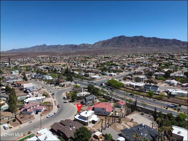 aerial view featuring a mountain view and a residential view