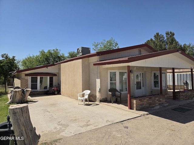 306 SW A St SW, Fabens, TX 79838 - rear view of house featuring a patio and stucco siding