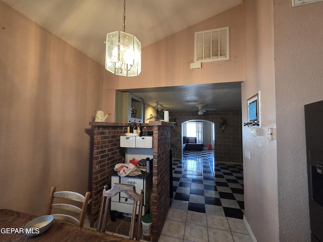 306 SW A St SW, Fabens, TX 79838 - hallway featuring an inviting chandelier, high vaulted ceiling, tile patterned floors, and visible vents