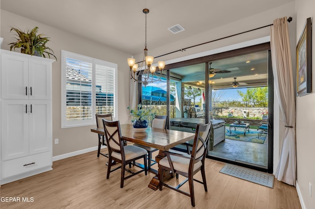 dining space featuring a healthy amount of sunlight, baseboards, light wood-style flooring, and visible vents