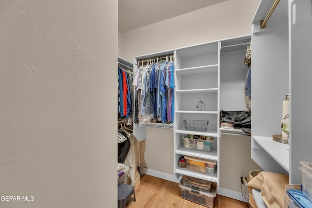 spacious closet with wood finished floors