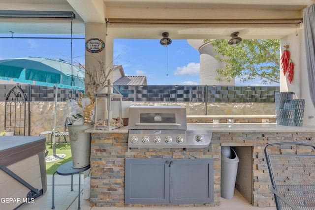 view of patio / terrace featuring a grill and exterior kitchen