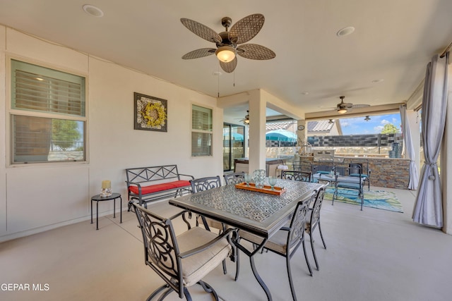 view of patio / terrace with outdoor dining area and a ceiling fan