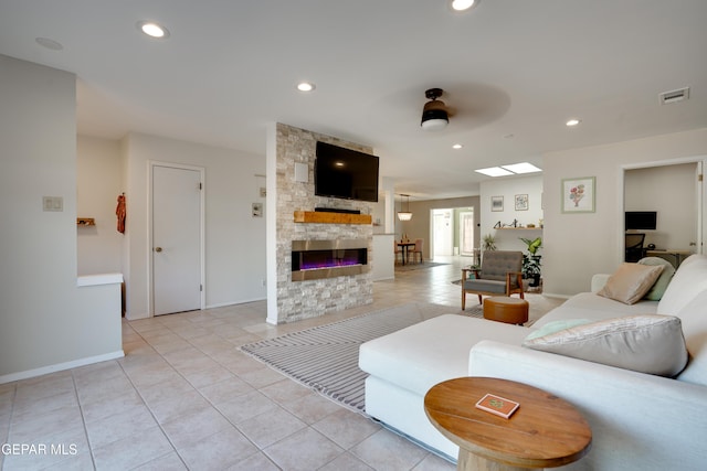 98 Northwind Dr, El Paso, TX 79912 - living area featuring light tile patterned flooring, a fireplace, baseboards, recessed lighting, and a ceiling fan