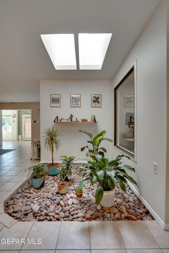 98 Northwind Dr, El Paso, TX 79912 - hall featuring a skylight and baseboards