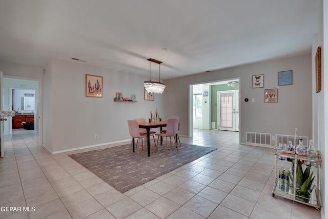 98 Northwind Dr, El Paso, TX 79912 - dining room with light tile patterned floors and baseboards