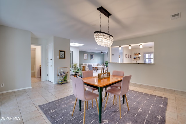 98 Northwind Dr, El Paso, TX 79912 - tiled dining space featuring a chandelier and baseboards