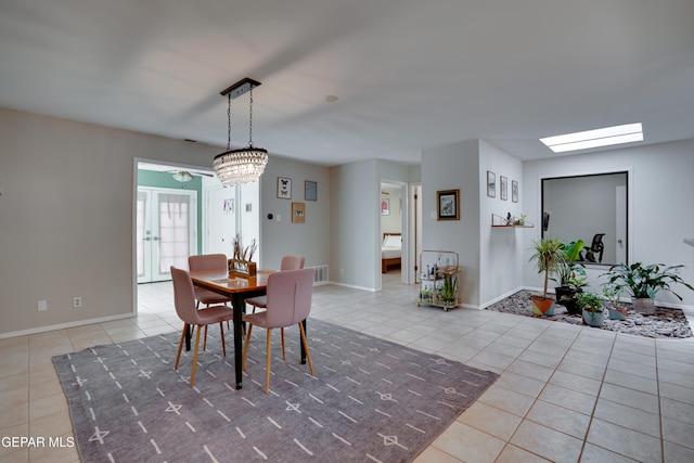 98 Northwind Dr, El Paso, TX 79912 - dining area featuring tile patterned floors, a skylight, baseboards, and ceiling fan