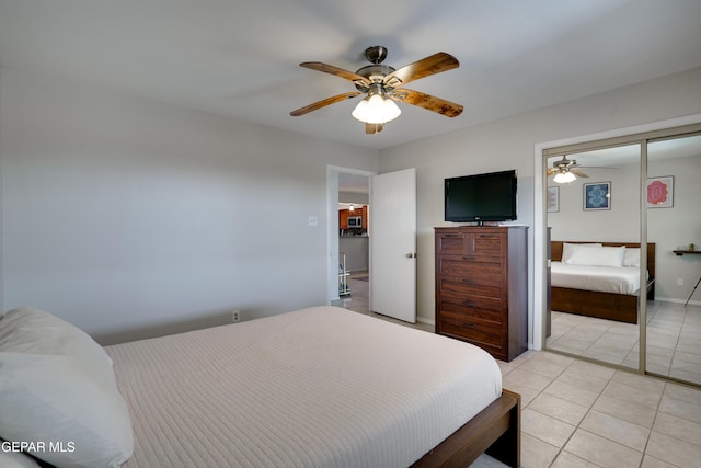 98 Northwind Dr, El Paso, TX 79912 - bedroom featuring light tile patterned flooring, ceiling fan, and a closet