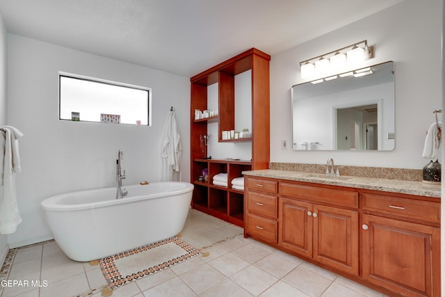 98 Northwind Dr, El Paso, TX 79912 - bathroom with vanity, a freestanding tub, and tile patterned floors