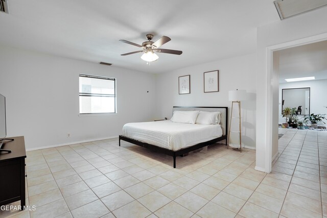 98 Northwind Dr, El Paso, TX 79912 - bedroom with light tile patterned floors, baseboards, and a ceiling fan