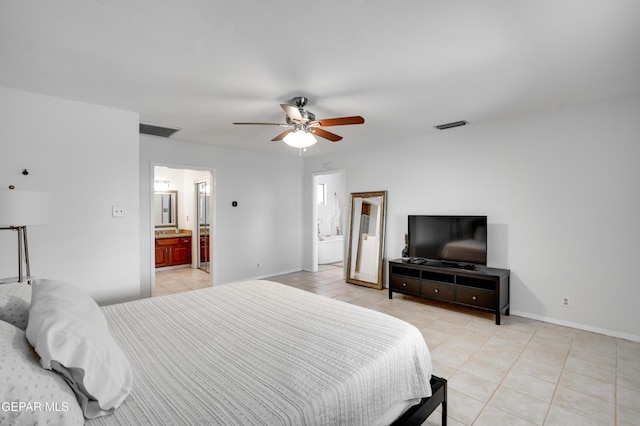 98 Northwind Dr, El Paso, TX 79912 - bedroom featuring light tile patterned flooring, connected bathroom, baseboards, and a ceiling fan