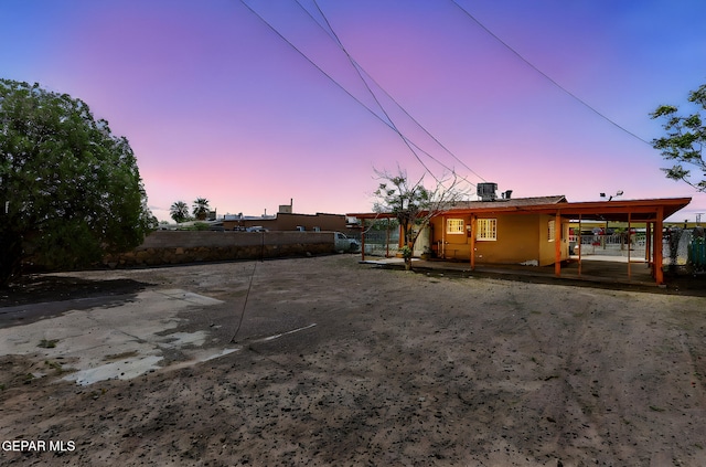 rear view of house with fence